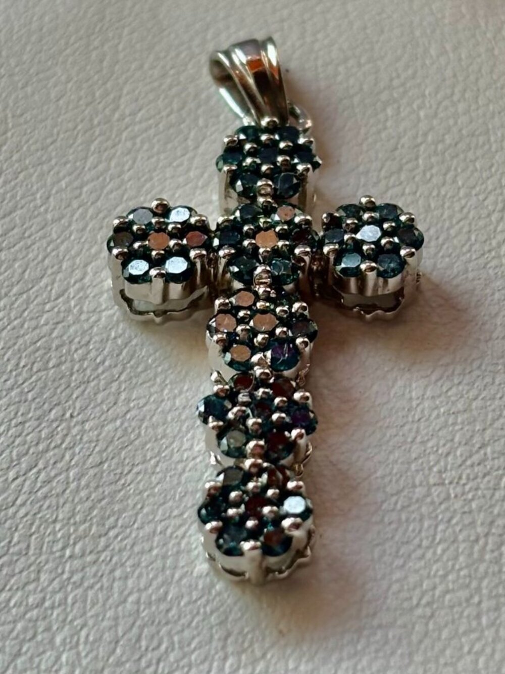 Blue round clusters Diamonds cross set in10k white gold.